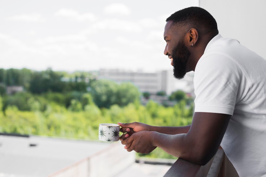 side-view-adult-male-enjoying-view-from-home_23-2148563585-min